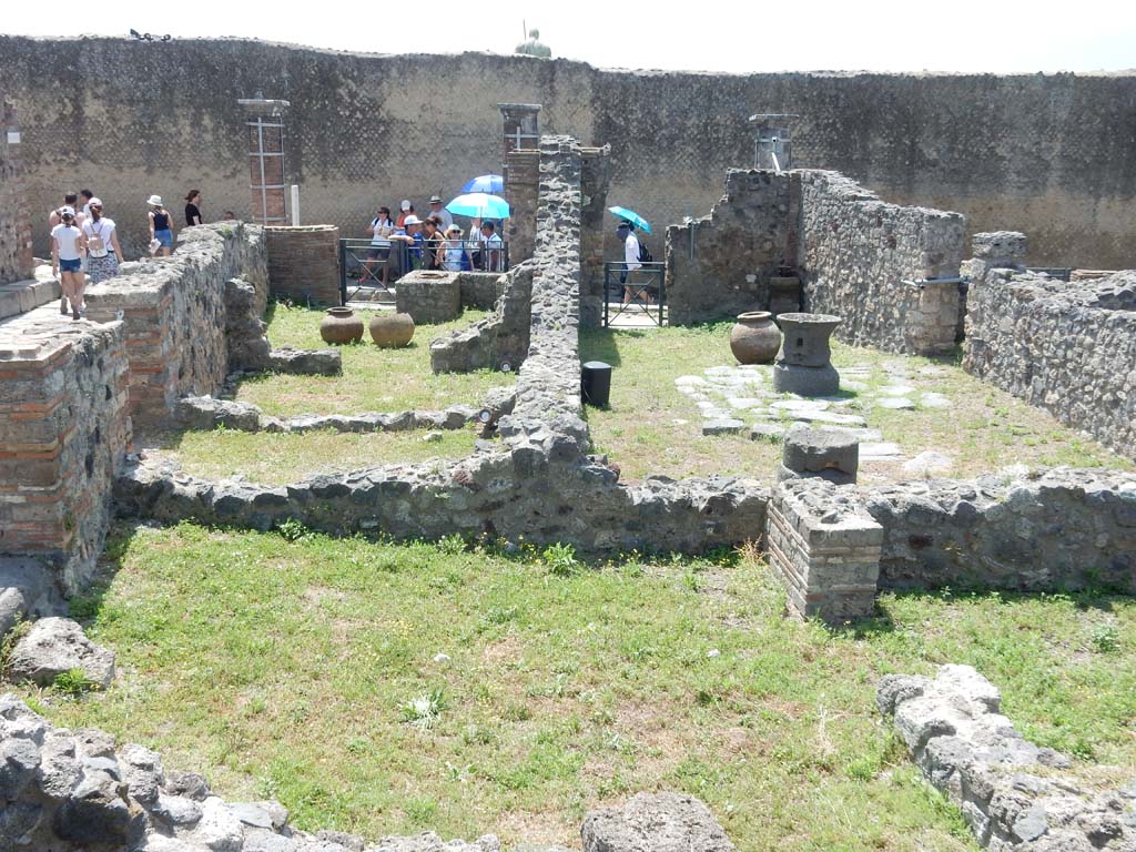 VII.16.7 Pompeii on left, and VII.16.6 on right. June 2019.
Looking south from remains of bakery at VII.16.9, across VII.16.8, on left, towards rear room of VII.16.7, upper left, and on towards entrance doorway onto Via Marina.
Photo courtesy of Buzz Ferebee.