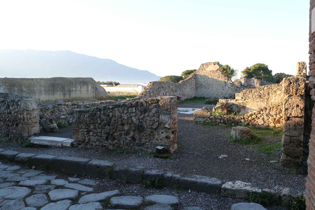 VII.16.11 Pompeii on right, and VII.16.10 on left. December 2018.
Looking west to entrance doorways. Photo courtesy of Aude Durand.