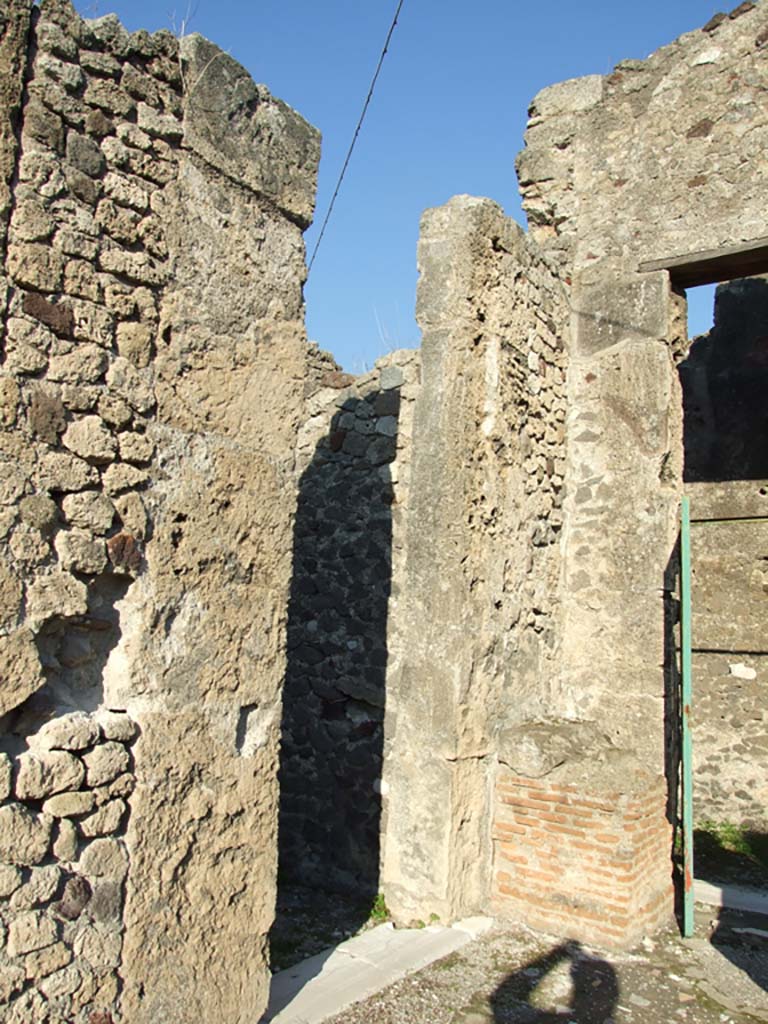 VII.16.13 Pompeii. December 2007. Doorway to room 5 on the north-east side of atrium, on the left.
According to Mau, there was an alcove for a bed opposite the doorway.
The ceiling of the alcove, in the form of a vault, was lower than that of the rest of the room.
See Mau, A., 1907, translated by Kelsey F. W. Pompeii: Its Life and Art. New York: Macmillan. (p. 300).