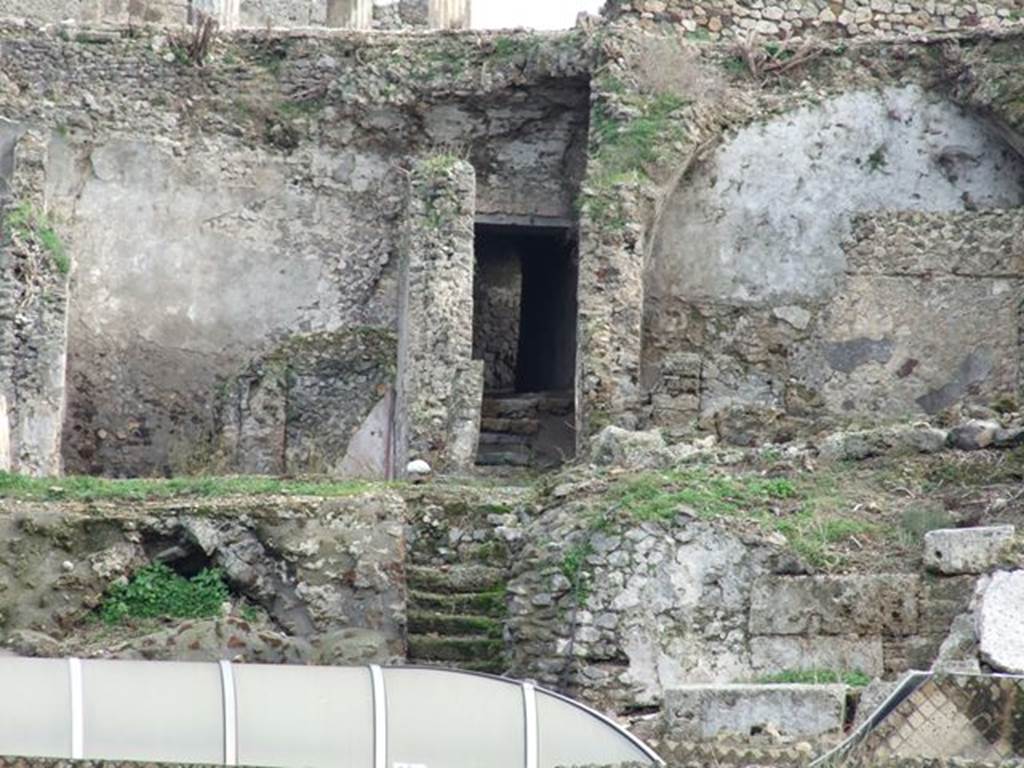 Rear of VII.16.13 Pompeii above Suburban Baths. December 2006. This photo shows the three levels of the house. At the very top is the peristyle area 18. Room 30, corridor 40 and rooms 22/23 are in the middle level. Vaulted room 38 is on the bottom left of the photo, covered by greenery.