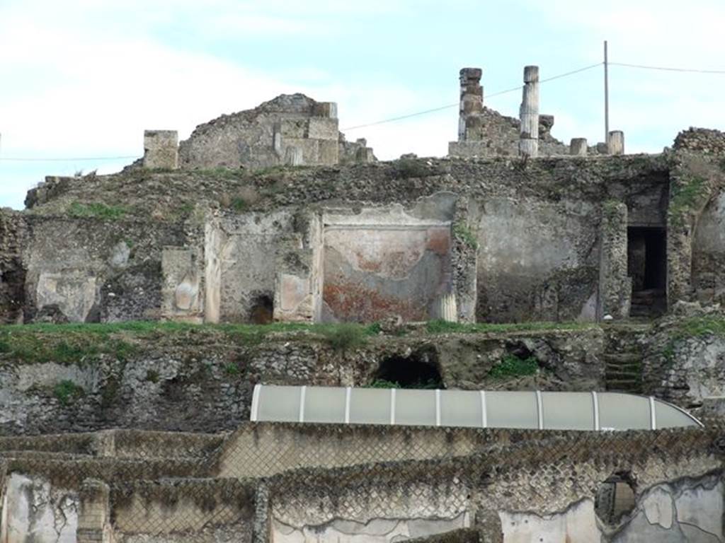 VII.16.13 Pompeii. December 2006. Rear of house above Suburban Baths. Immediately above the plastic roof two rooms, 37 and 38, with vaulted ceilings, can be seen. They were not able to be photographed. These rooms are on a level below the middle level rooms 31 and 30 seen above them.