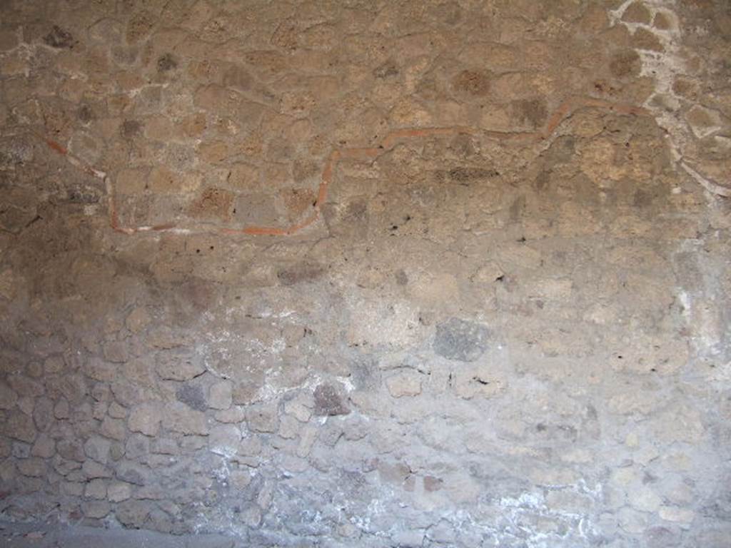 VII.16.19 Pompeii. September 2005. Original wall (below the terracotta tiled line) and reconstructed wall (above the terracotta line).