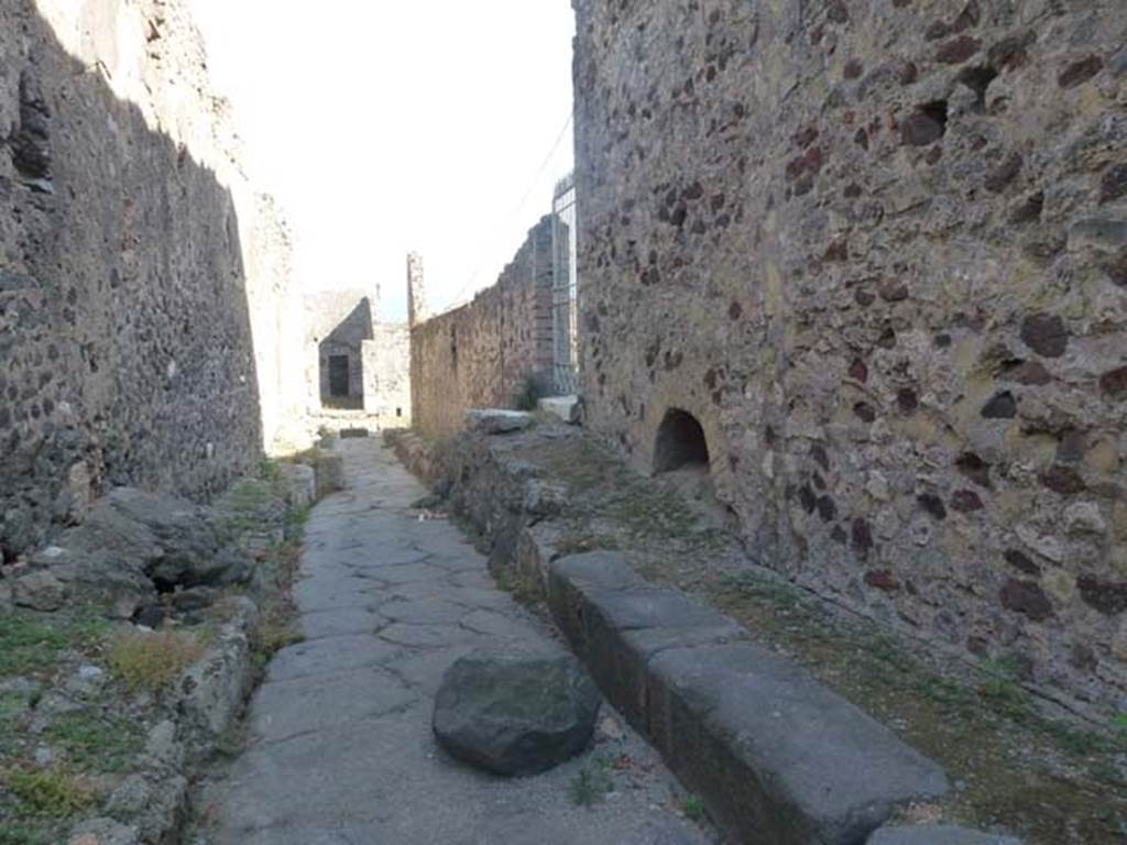 VII.6 Pompeii, on right. June 2012. Looking south on Vicolo del Farmacista. The entrance doorway to VII.16.20 can be seen on right of centre of the photo.