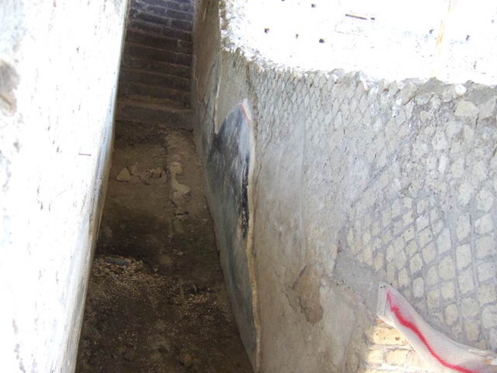VII.16.17-22 Pompeii. May 2006. North end of rear garden area on lower ground level, looking east towards stairs from corridor alongside garden.