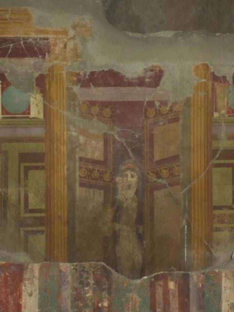 VII.16.17-22 Pompeii. May 2012. Detail of woman standing in doorway in centre of concealed wall. Photo courtesy of Marina Fuxa.