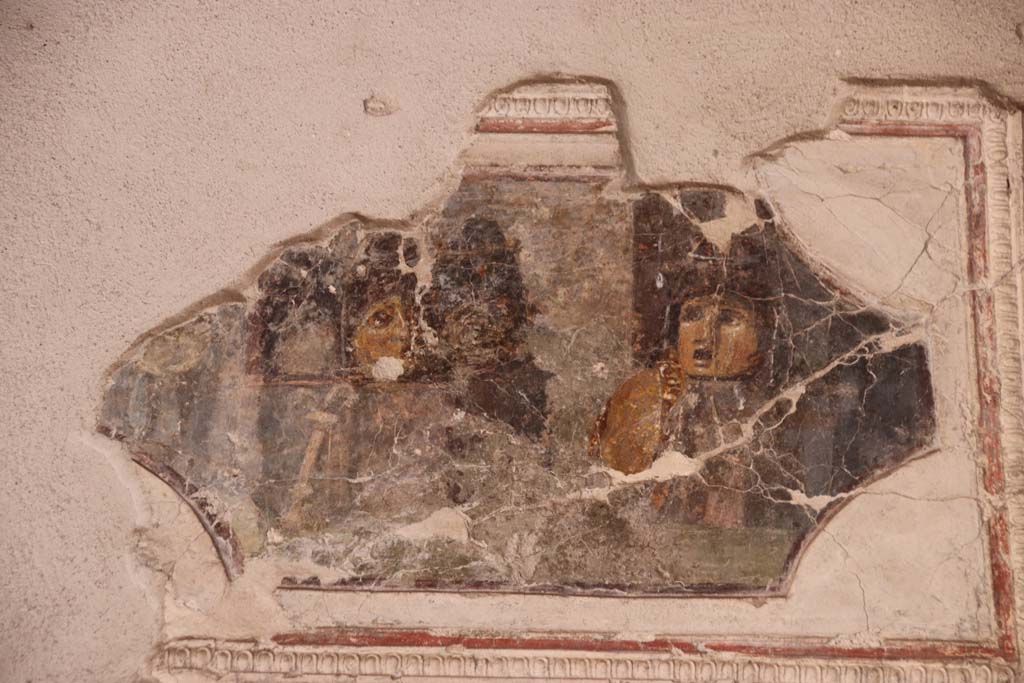 VII.16.a Pompeii. September 2021. Room 1, painting of masks on north wall. Photo courtesy of Klaus Heese.