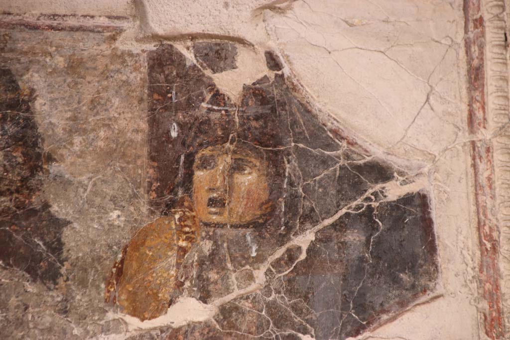VII.16.a Pompeii. September 2021. Room 1, detail of mask on north wall. Photo courtesy of Klaus Heese.