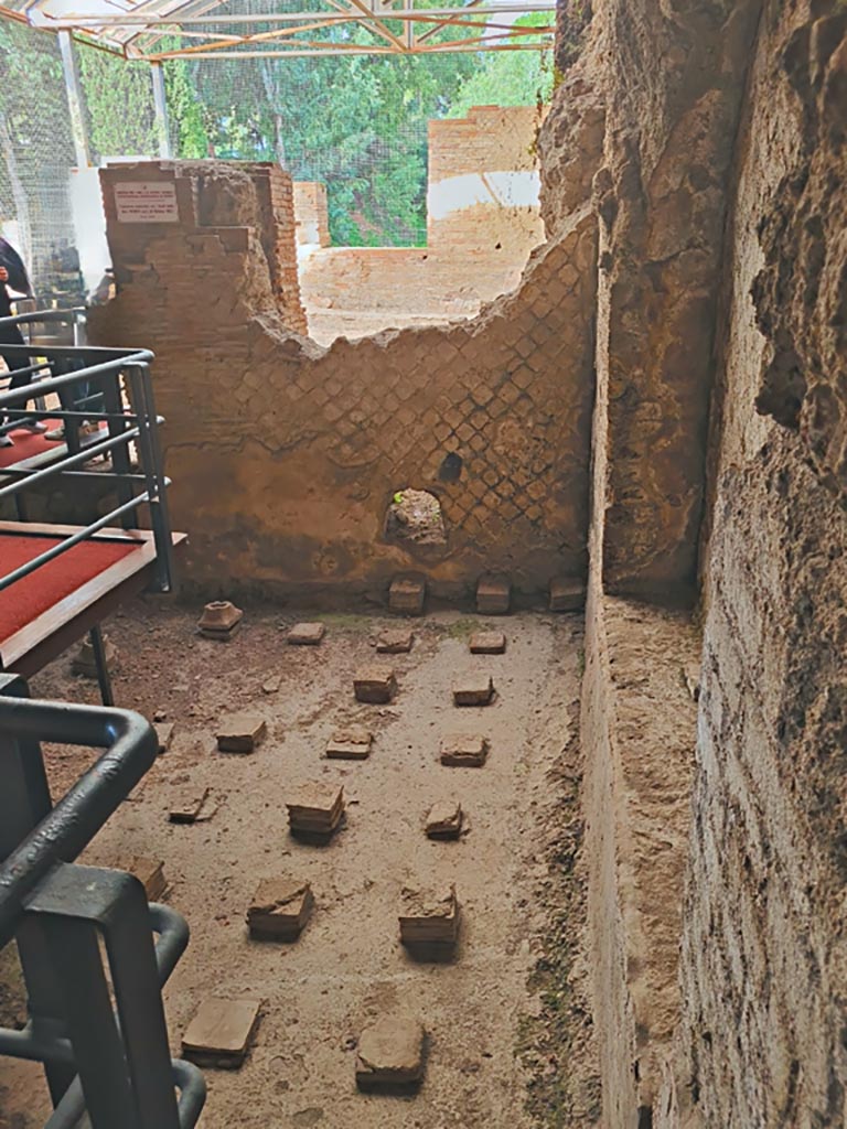 VII.16.a Pompeii. November 2023.
Room 3, with remains of hypocaust floor. Looking north towards pool. Photo courtesy of Giuseppe Ciaramella.