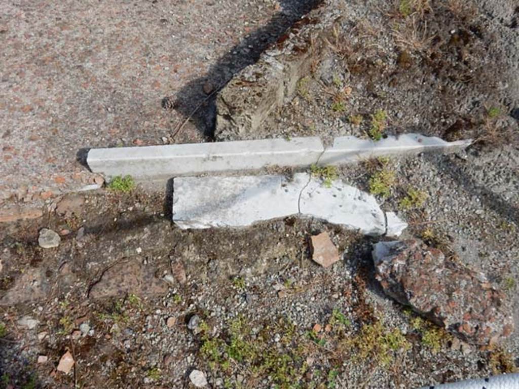 VII.16.a Pompeii. May 2015. Remains of marble at ground level, near debris. Photo courtesy of Buzz Ferebee.