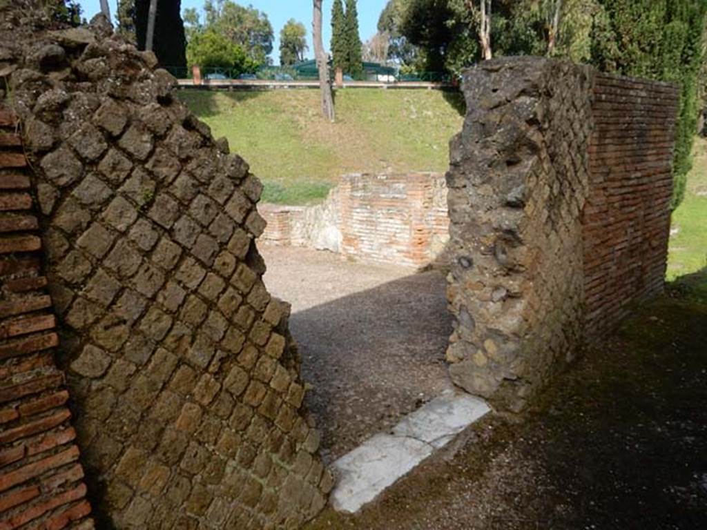 VII.16.a Pompeii. May 2015. Looking north-west through doorway into room at the north end of courtyard C. Photo courtesy of Buzz Ferebee.