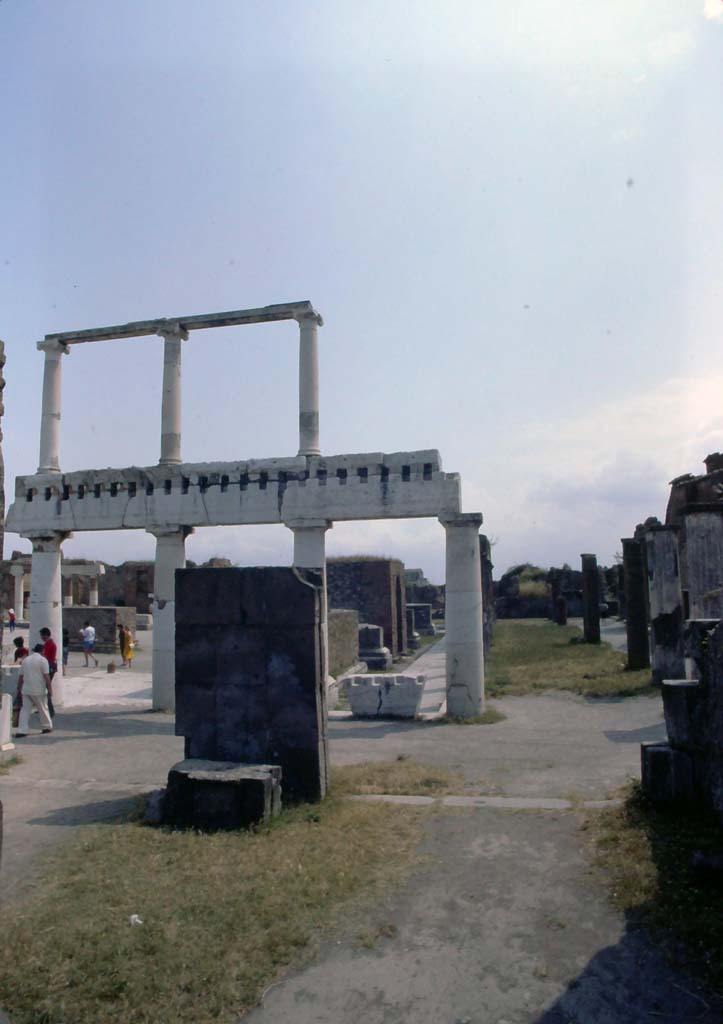 VIII.1.1 Pompeii, July 1980. Looking east from Basilica across south end of Forum.
Photo courtesy of Rick Bauer, from Dr George Fay’s slides collection.