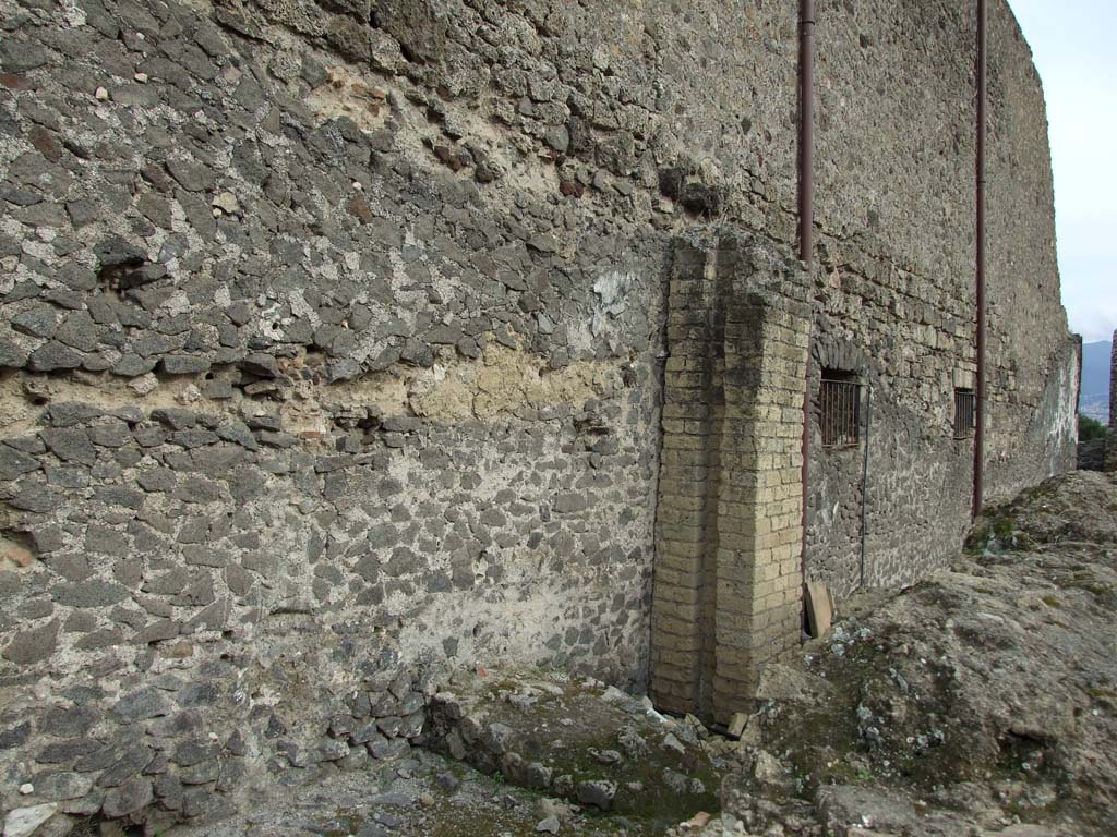 VIII.1.3 Pompeii. March 2009. Road between Basilica and Temple of Venus near VIII.1.5.
Remains of water supply column against west wall of Basilica.
