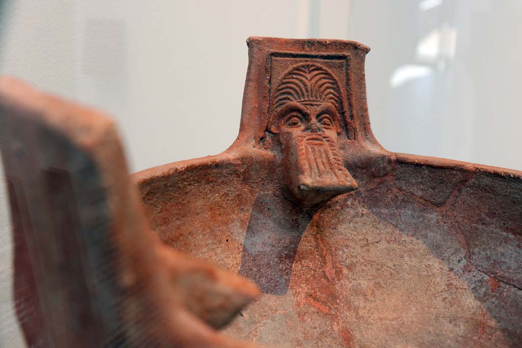 VIII.1.4 Pompeii. February 2021.
Detail of terracotta brazier with the heads of Silenus, made in Asia Minor (western coast of Turkey).
Items dug out of the dump (scarico) on the west side of the Forum. Photo courtesy of Fabien Bièvre-Perrin (CC BY-NC-SA).
