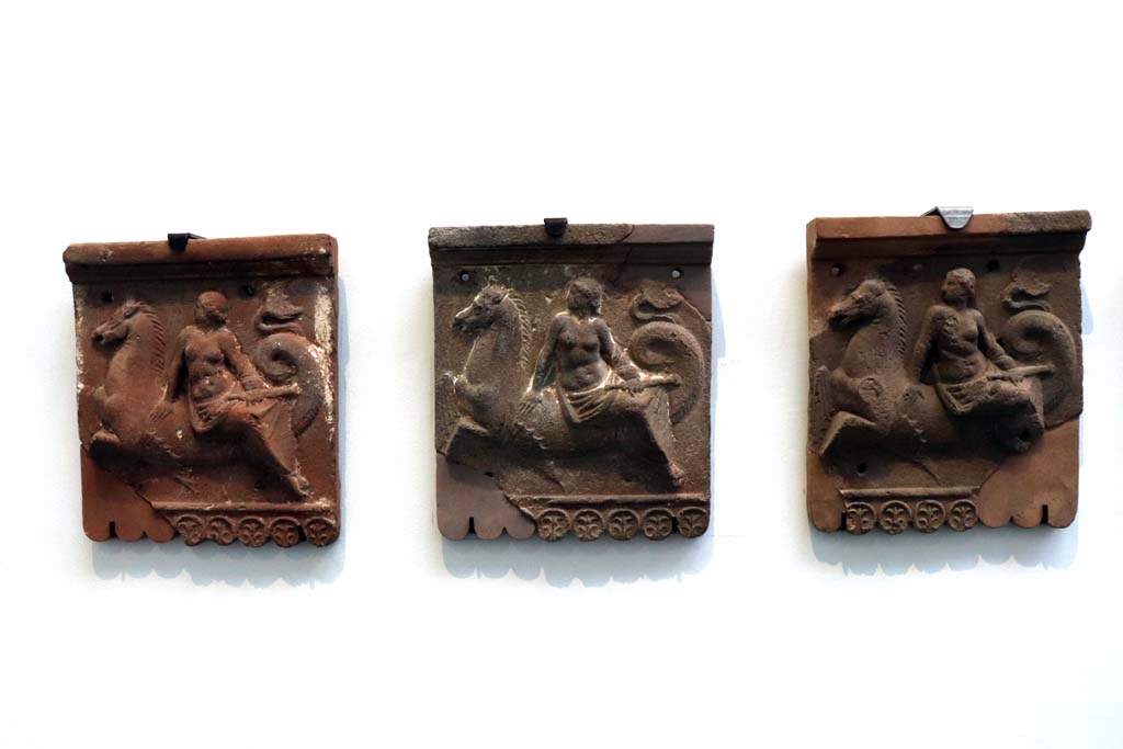 VIII.1.4 Pompeii. February 2021. Terracotta slabs with nereids on tritons (from Pompeii).
Photo courtesy of Fabien Bièvre-Perrin (CC BY-NC-SA).