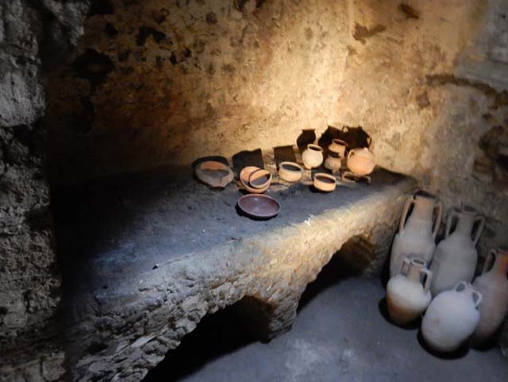 VIII.2.1 Pompeii. May 2018.
Looking west through doorway to kitchen D on west side of east corridor/cryptoporticus. Photo courtesy of Buzz Ferebee.