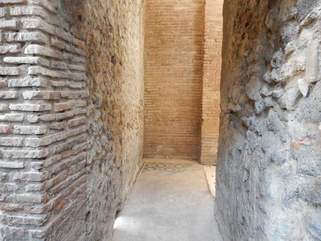 VIII.2.1 Pompeii. May 2018. Ground floor level. Looking west along corridor near steps/stairs to upper and lower floors. The south-east corner of the atrium is through the doorway on the right. Photo courtesy of Buzz Ferebee. The steps that would have led up to the upper floor are on the left, next to the steps down to the lower level.