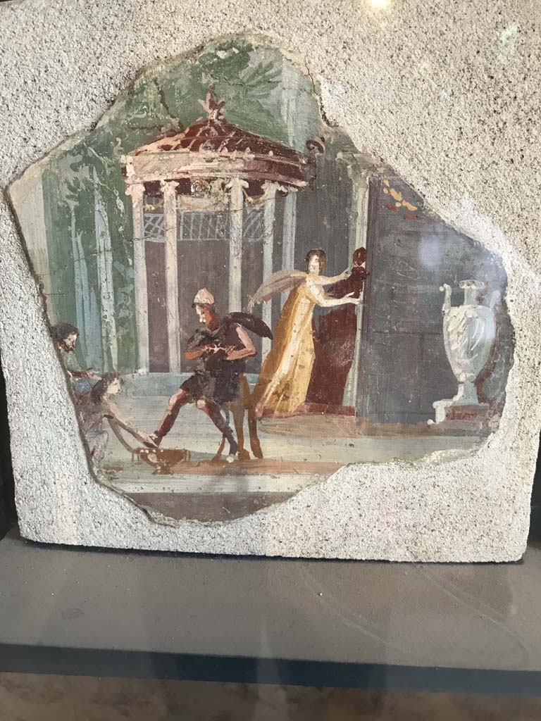 VIII.2.1 Pompeii. April 2019. Fragment of fresco showing the return of Odysseus to Ithaca.
Found 31st December 1973, outside of the wall of the third room under the House of Championnet.
Pompeii Inventory number 14231. Photo courtesy of Rick Bauer.