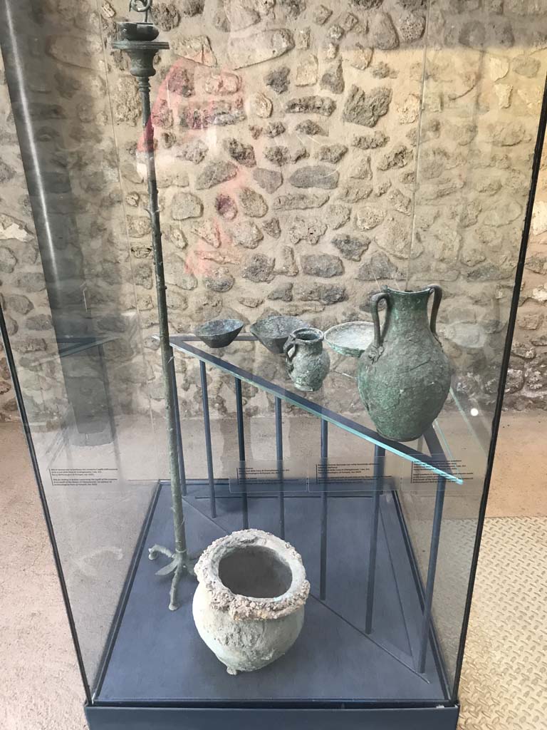 VIII.2.1 Pompeii. April 2019.
Display case with finds from excavations conducted in the area since the 1930’s.
Photo courtesy of Rick Bauer.