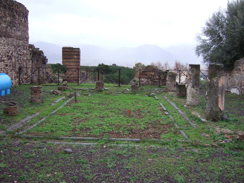 VIII.2.3 Pompeii. December 2005. Looking south across peristyle garden.
According to Jashemski, this peristyle garden, was enclosed on four sides by a portico supported by fourteen columns.
Off the north-west corner of the peristyle was a small room which Mazois and Fiorelli call a sacrarium.
At the rear, there was a terrace.
See Jashemski, W. F., 1993. The Gardens of Pompeii, Volume II: Appendices. New York: Caratzas. (p.205)