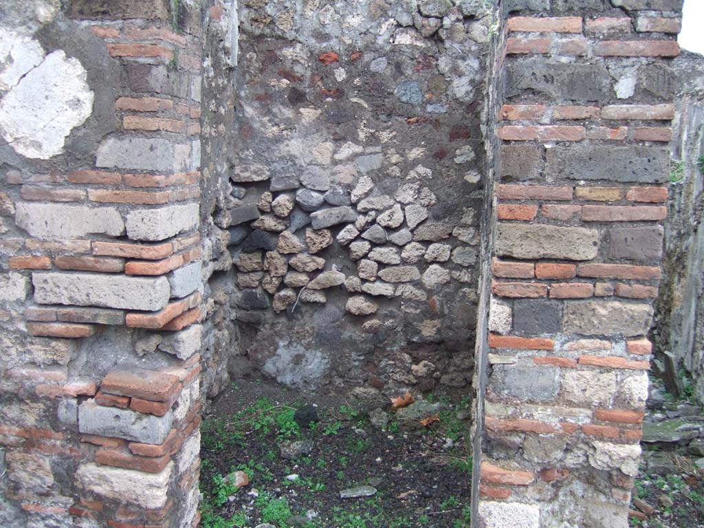 VIII.2.3 Pompeii. December 2005. Small room on north-west corner of the peristyle.
According to Boyce, off the north-west corner of the peristyle opened a small room which Mazois and Fiorelli called the lararium.
See Boyce G. K., 1937. Corpus of the Lararia of Pompeii. Rome: MAAR 14. (p.74, no.342)
