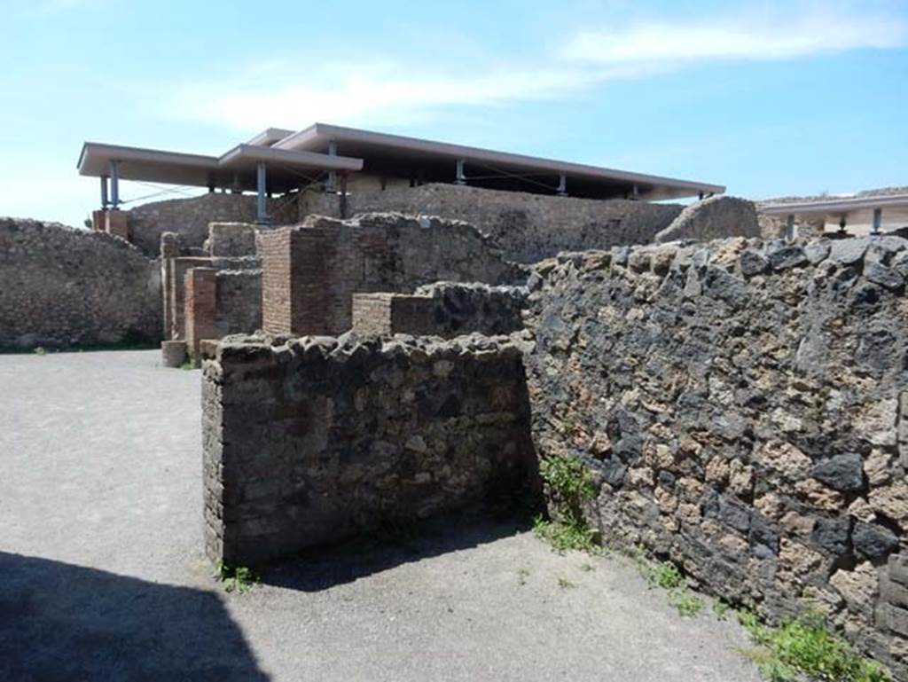 VIII.2.3 Pompeii. May 2018. Looking north-west from rear of VIII.2.5, across north portico of peristyle, at rear of tablinum.
Photo courtesy of Buzz Ferebee.