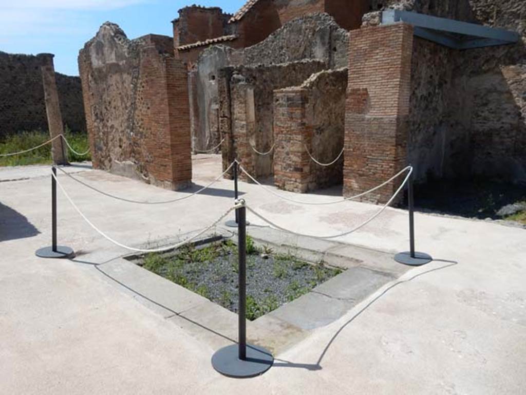 VIII.2.13 Pompeii. May 2018. Looking north-west across atrium, with tablinum, on left.
On the west side next to the tablinum is a doorway to the triclinium overlooking the garden at its north end. Next to the triclinium doorway, are the doorways to rooms on the north side of atrium. Photo courtesy of Buzz Ferebee.
