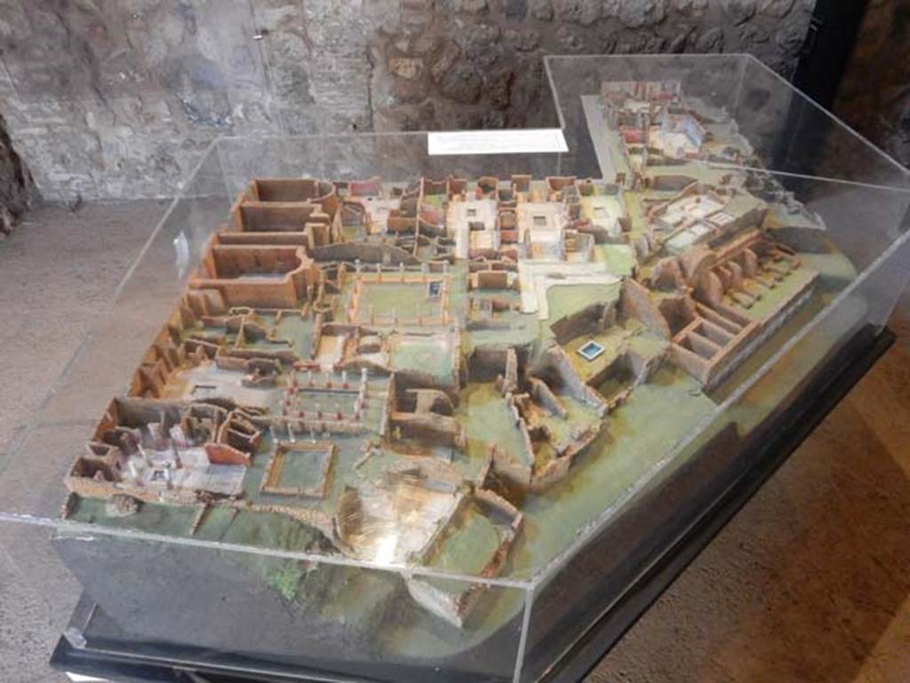 VIII.2 Pompeii. May 2018. Cork model of area seen from the west, with the Houses of Championnet, seen on the left, and Sarno Baths, on the right.
Photo courtesy of Buzz Ferebee.