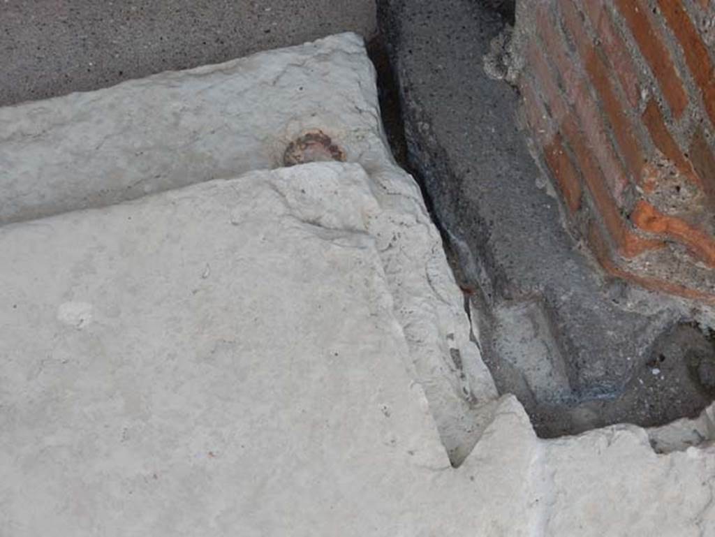 VIII.2.16 Pompeii. May 2017. Detail of west side of doorway threshold to central cubiculum. Photo courtesy of Buzz Ferebee.