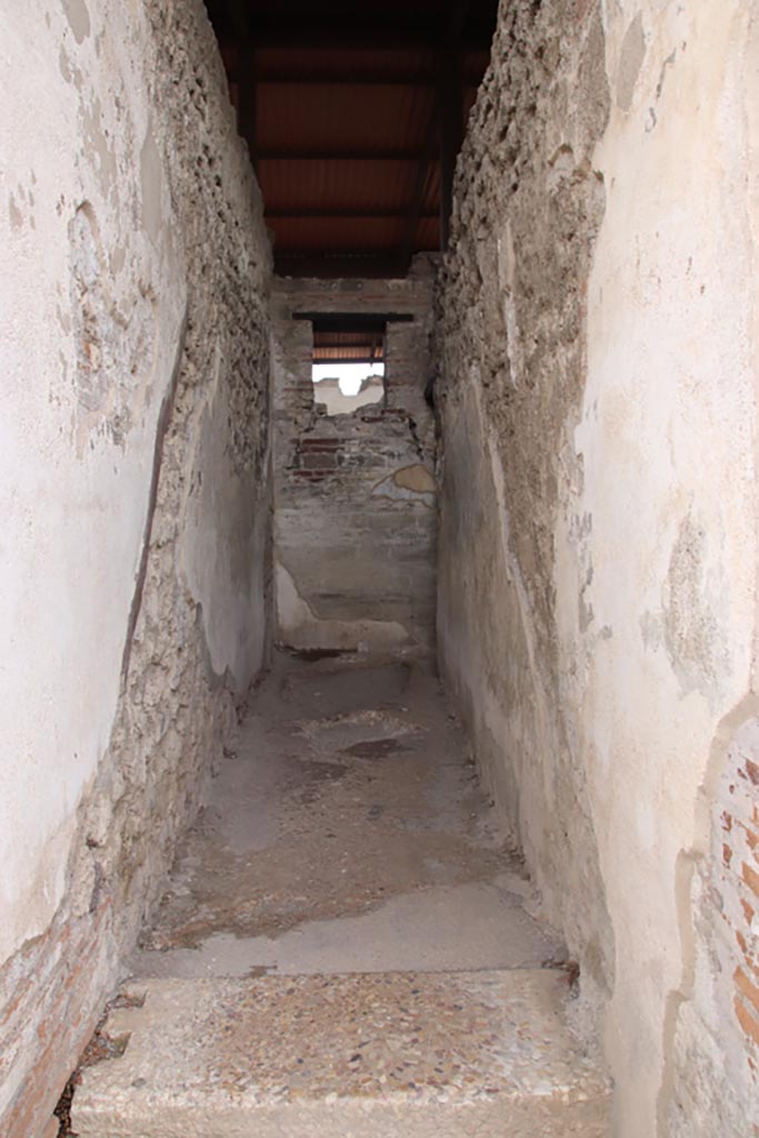 VIII.2.22 Pompeii. May 2024.
Looking south, with line of steps to upper floor visible on both side walls. Photo courtesy of Klaus Heese.