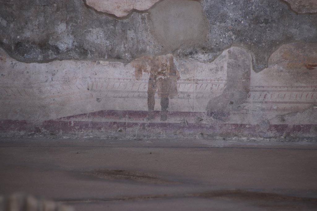 VIII.2.23 Pompeii. October 2022.
Detail of painted figure from zoccolo/dado towards the west end of the south wall. Photo courtesy of Klaus Heese.