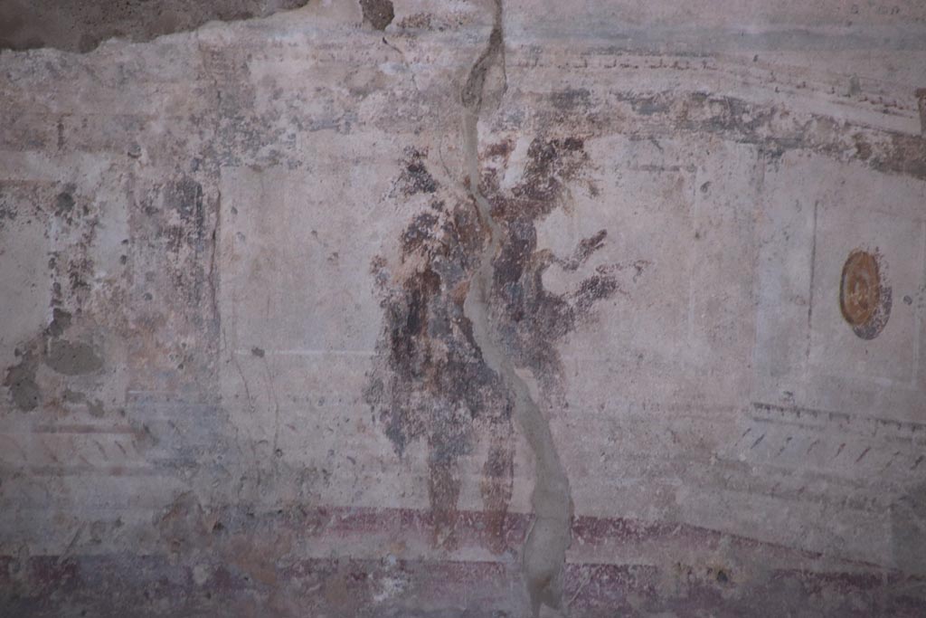 VIII.2.23 Pompeii. October 2022.
Detail of painted figure from the zoccolo/dado towards the west end of the south wall. Photo courtesy of Klaus Heese.