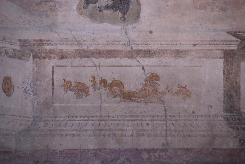 VIII.2.23 Pompeii. October 2022.
Detail of painted dolphins and sea creature from the zoccolo/dado towards the west end of the south wall. Photo courtesy of Klaus Heese.