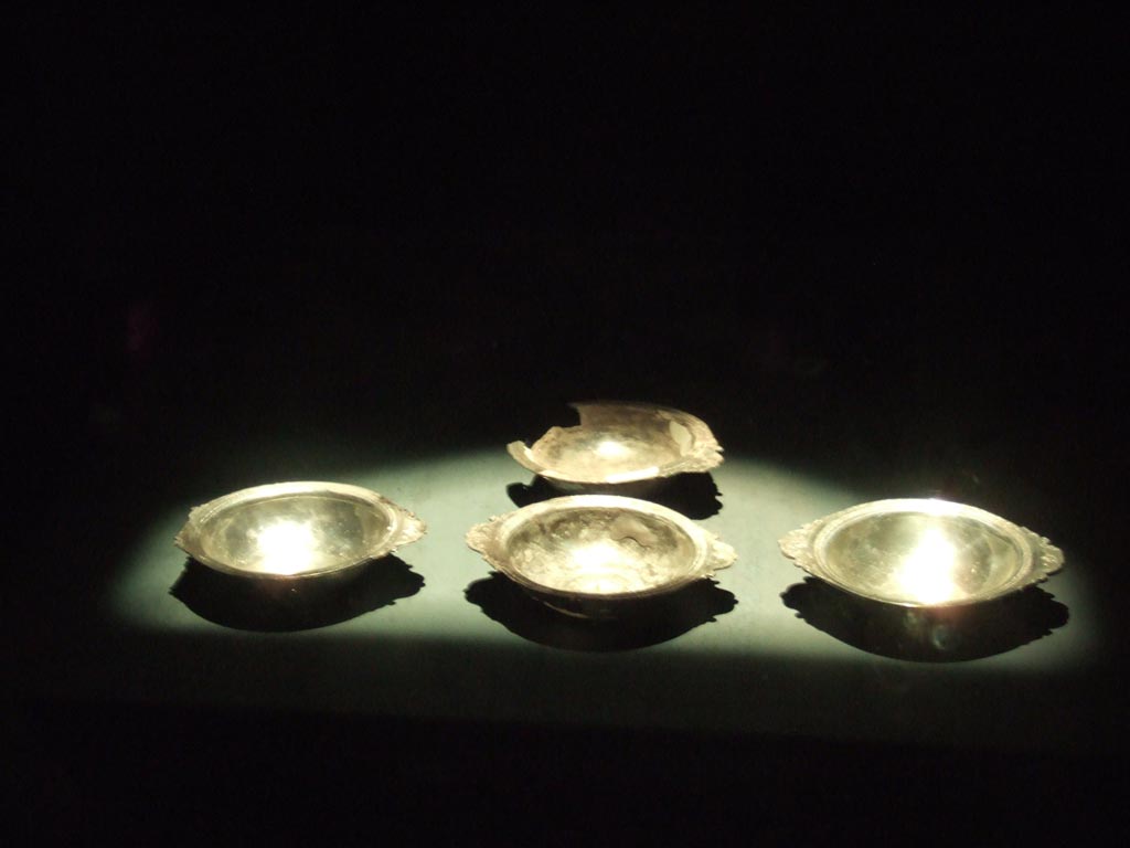 Four silver plates found 20th September 1887 in VIII.2.23.
Now in Naples Archaeological Museum. Inventory numbers 116341, 116342, 116343 and 116344.
See Guzzo, P. (A cura di), 2006. Argenti a Pompei. Milano, Electa. (p. 133).