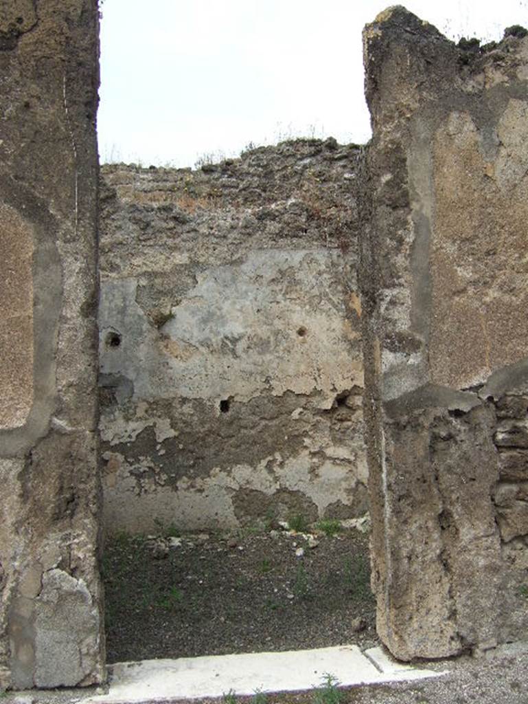 VIII.2.34 Pompeii. May 2006. Looking west through middle doorway of small room, on west side of atrium.