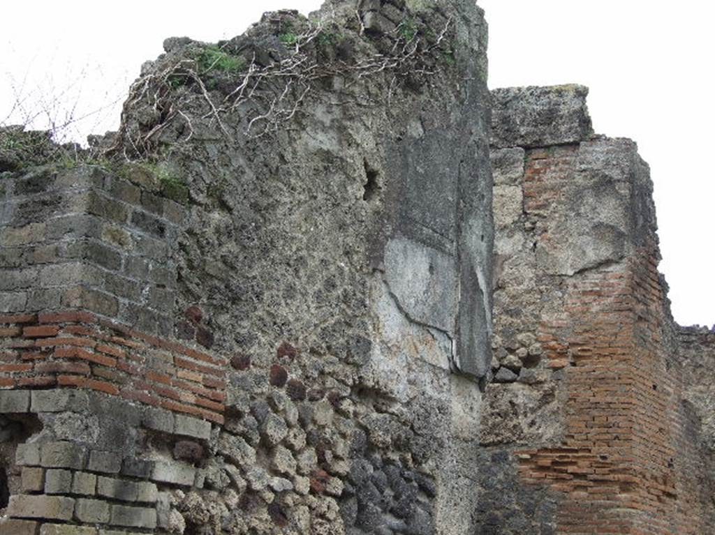Front wall to east of entrance of VIII.2.34. December 2006. Looking west.