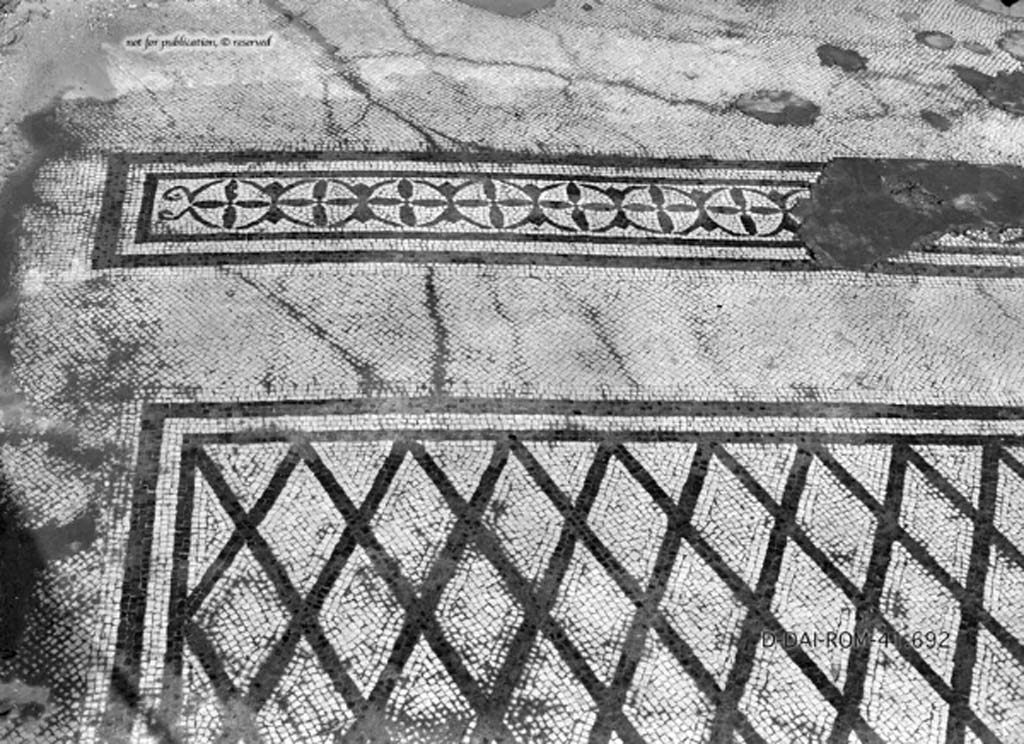 VIII.2.34 Pompeii. c.1930. Room ‘11’ on lower floor, described by Pernice and PPM as a cubiculum.
According to Blake - originally this room would have had an elegant flooring of mosaic with a net of lozenges delineated in black on a white background.
There was a narrow strip with a double row of black corolla with four petals and buds combined in a manner to form circles, typically III style.
DAIR 41.692. Photo © Deutsches Archäologisches Institut, Abteilung Rom, Arkiv.
See Pernice, E. 1938. Pavimente und Figürliche Mosaiken: Die Hellenistische Kunst in Pompeji, Band VI. Berlin: de Gruyter, (tav. 32.3, above.)