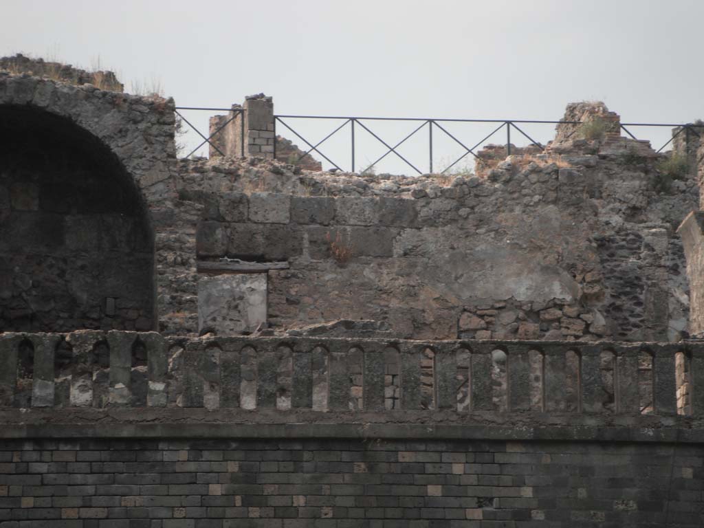 VIII.2.34 Pompeii. May 2011.
Room ‘8’, looking north across middle triclinium on lower level towards detail of north wall. Photo courtesy of Ivo van der Graaff.