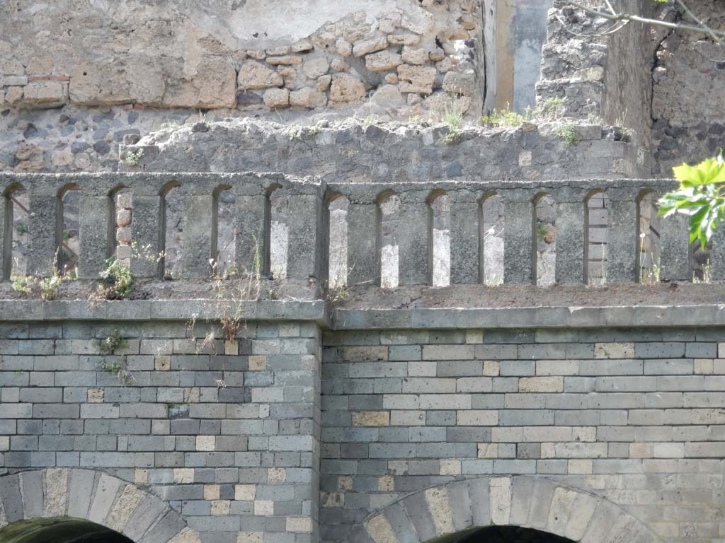 VIII.2.34 Pompeii. June 2019.
Looking north from rear towards terrace with low parapet wall, which originally would have been covered with white plaster and formed as small arches.
Photo courtesy of Buzz Ferebee.