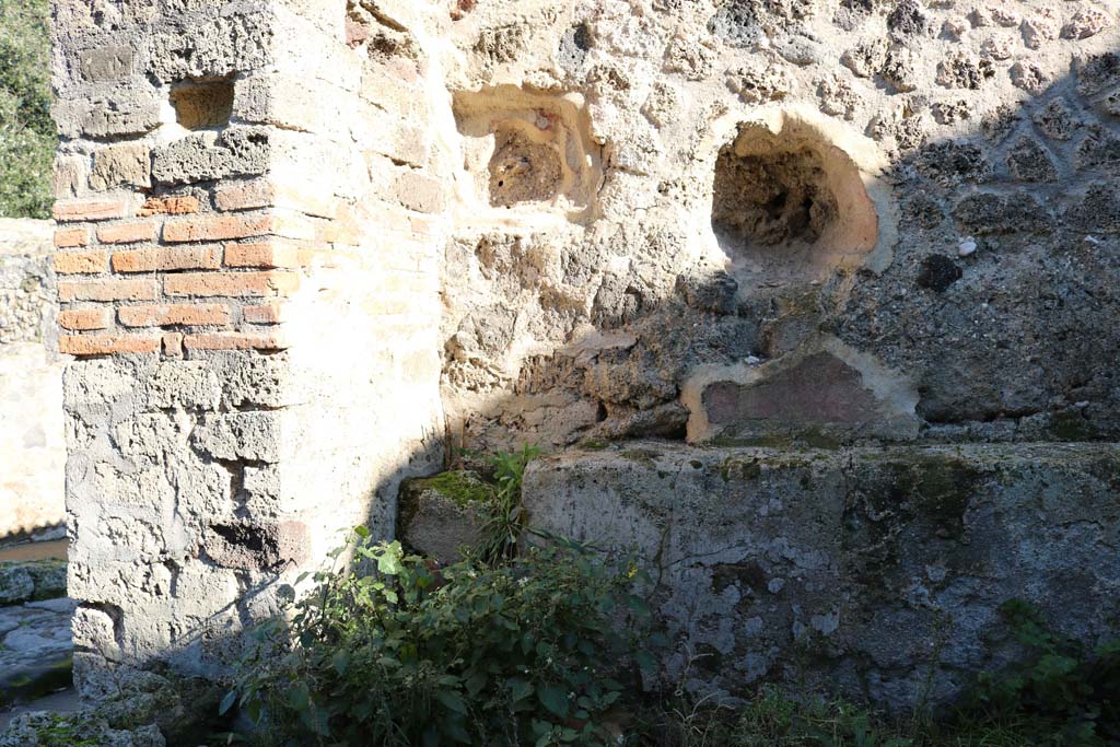 VIII.2.35 Pompeii. December 2018.
Looking towards east wall in north-east corner near entrance doorway. Photo courtesy of Aude Durand.
According to Boyce –
in the east wall of this taberna with thermopolium, is an arched niche (h.0.30, w.0.38, d.0.28, h. above floor 1.05).
Its walls were coated with red stucco.
See Boyce G. K., 1937. Corpus of the Lararia of Pompeii. Rome: MAAR 14. (p.75, no.348)