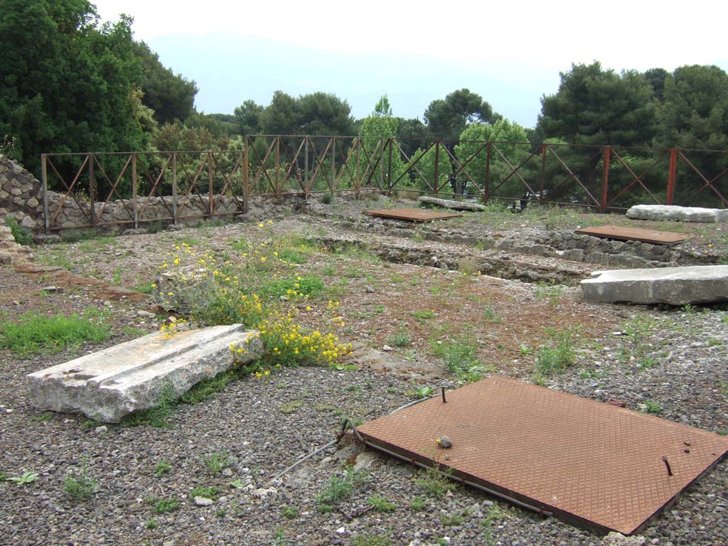 VIII.2.37 Pompeii. May 2006. Looking south-east across the peristyle area with narrow masonry pool at the south end.
According to Jashemski, the peristyle at the rear of the atrium of house 37, two steps higher than the atrium, was surrounded on three sides by a portico.
It was supported by stucco-covered columns, only three of which are preserved today (1993).
The enclosed area was paved. The paved area contained a narrow masonry pool, a fact deduced by the excavators from the depression in the pavement.
This paved court with a pool, would no doubt have served as a garden.
At the rear of this double house (on both the street and lower level) were terraces overlooking the bay and mountains.
The terraces at the rear of house 36 were preceded by a portico.
See Jashemski, W. F., 1993. The Gardens of Pompeii, Volume II: Appendices. New York: Caratzas. (p.209)