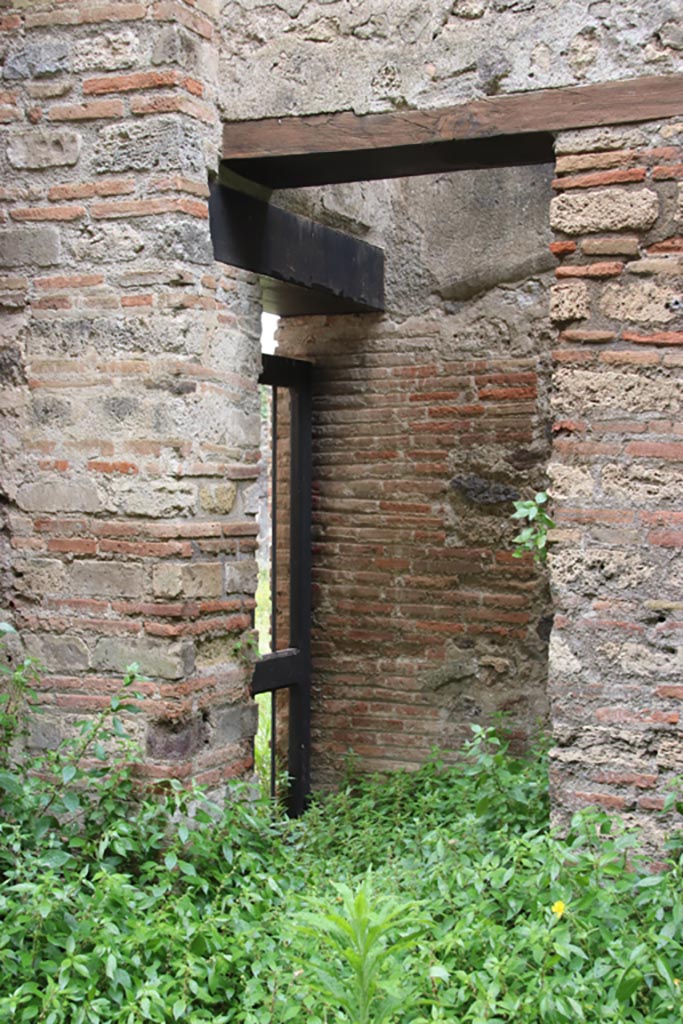VIII.2.38 Pompeii. May 2024.
South-east corner of shop-room with doorway to kitchen of VIII.2.39. Photo courtesy of Klaus Heese.