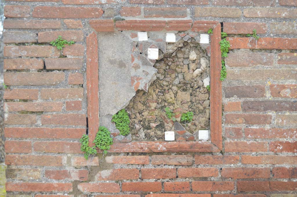 VIII.3.6 Pompeii, on left, and VIII.3.5, on right. March 2018. Detail of plaque on pilaster between doorways.
Foto Taylor Lauritsen, ERC Grant 681269 DÉCOR.