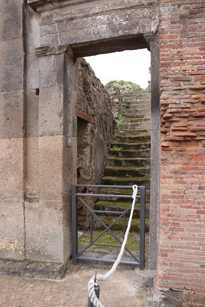 VIII.3.10 Pompeii. May 2024.
Steps to upper floor, and doorway in east wall into VIII.3.11. Photo courtesy of Klaus Heese.