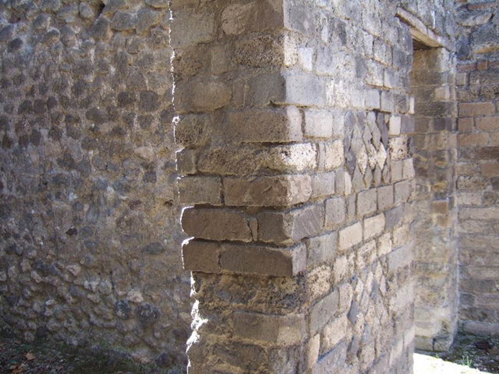 VIII.3.12 Pompeii. September 2005. Looking south from entrance to doorways, on left to kitchen and latrine, and cubiculum, on right.
The cubiculum would have been decorated in the IV Style with a red zoccolo/dado with plants in panels, and with a yellow middle zone to the walls.

