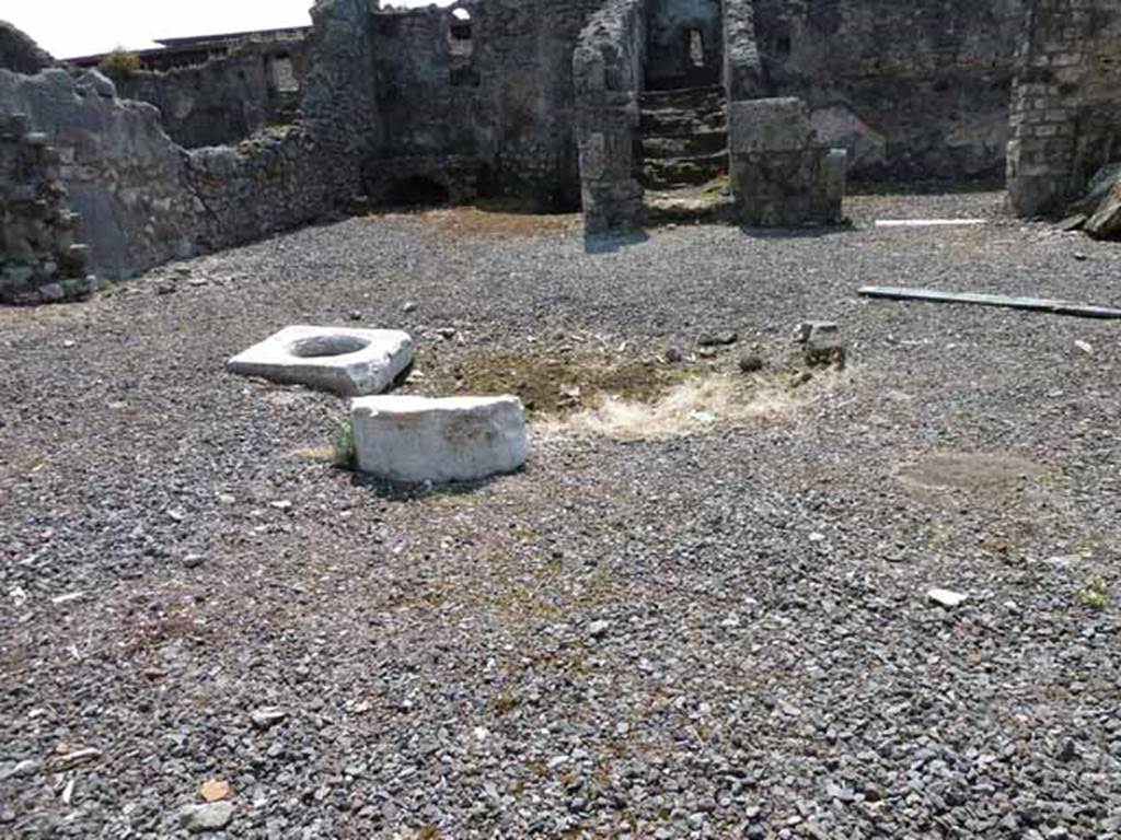VIII.3.18 Pompeii. May 2010. Looking south to site of impluvium and cistern lid in atrium. Taken from VIII.3.19.