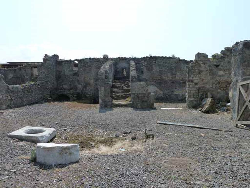VIII.3.18 Pompeii. May 2010.
Looking south across atrium towards kitchen, steps to upper floor and triclinium in south-west corner. Photo taken from VIII.3.19.
