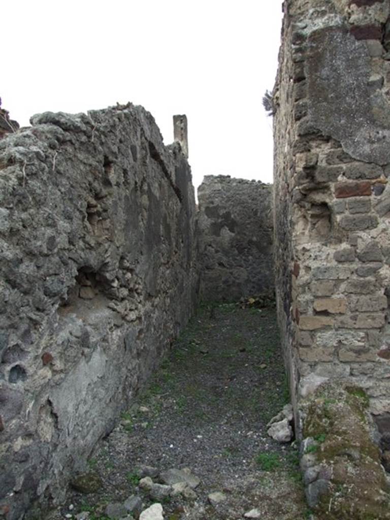 VIII.3.27 or VIII.3.24 Pompeii. December 2007. Looking west along the long narrow room on south side of the kitchen.