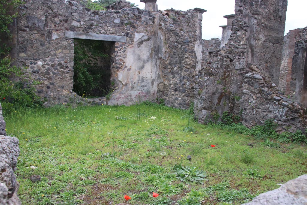 VIII.3.28 Pompeii. May 2024.
Looking south-east across the site of the rear room towards the portico of VIII.3.27, on right. Photo courtesy of Klaus Heese.