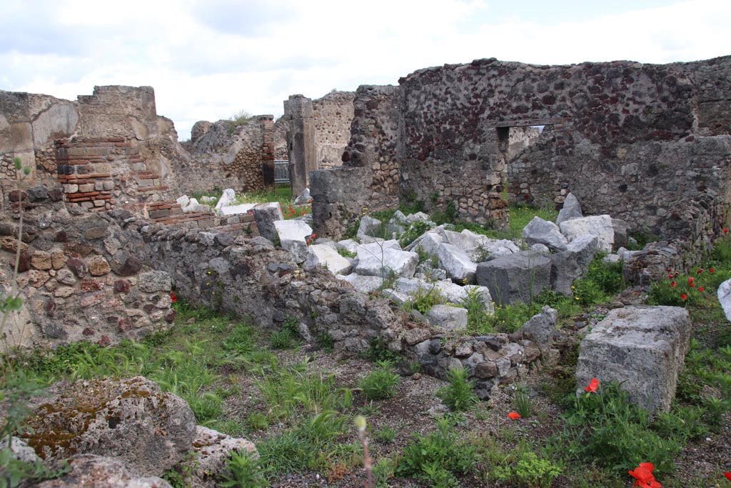 VIII.3.31 Pompeii. May 2024.
Looking east across small room or cupboard in the north-west corner of the peristyle, towards the oecus with two doorways.
Photo taken across the wall of VIII.3.29. Photo courtesy of Klaus Heese.