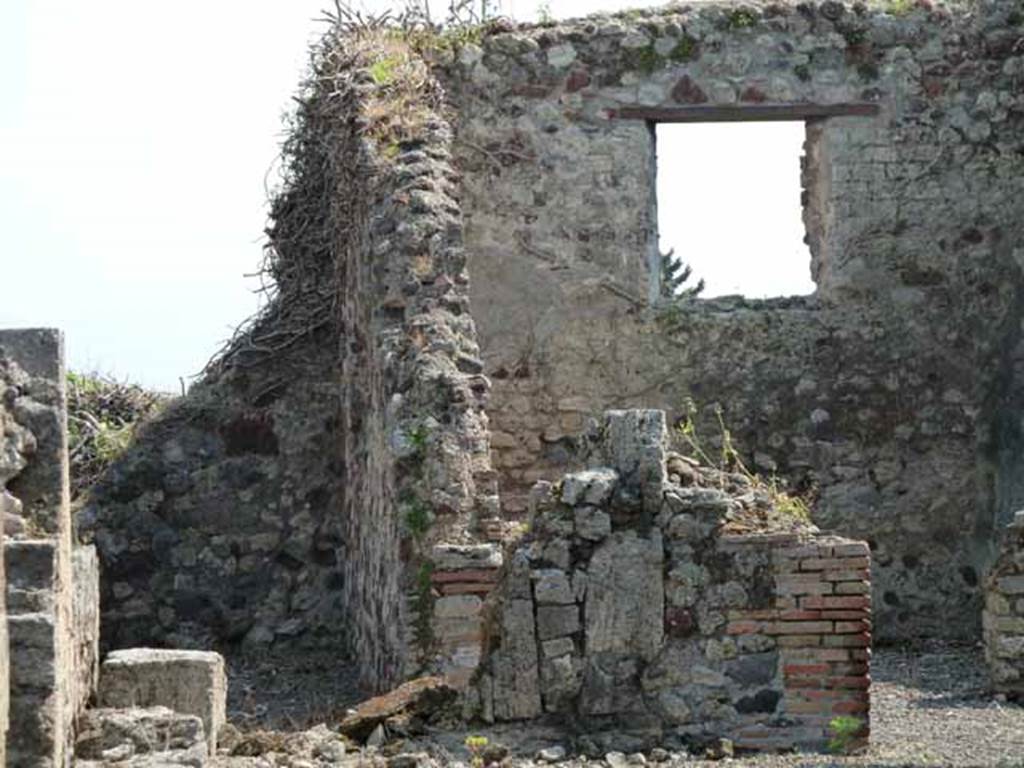 VIII.3.31 Pompeii. May 2010. On the left, the corridor to an exedra, two cubicula, the kitchen and latrine. According to Fiorelli, found in the exedra reached by the corridor, was a landscape painting showing Hercules and Telamon freeing Hesione. Nothing remains other than the description by Helbig. On the right a large exedra with window. Taken across the wall of VIII.3.29.
See Fiorelli, G., 1875. Descrizione di Pompei, Napoli, (p.331)
See Helbig, W., 1868. Wandgemälde der vom Vesuv verschütteten Städte Campaniens. Leipzig: Breitkopf und Härtel. (H 1131)